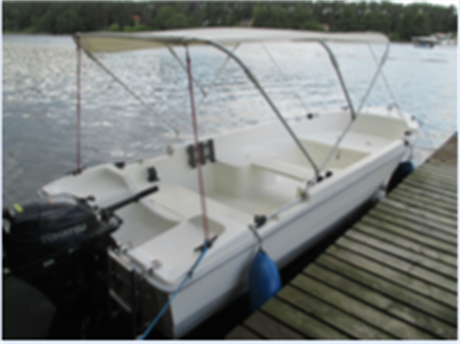 Motorboot „Sa Pa“ mit Sonnenverdeck am Steg